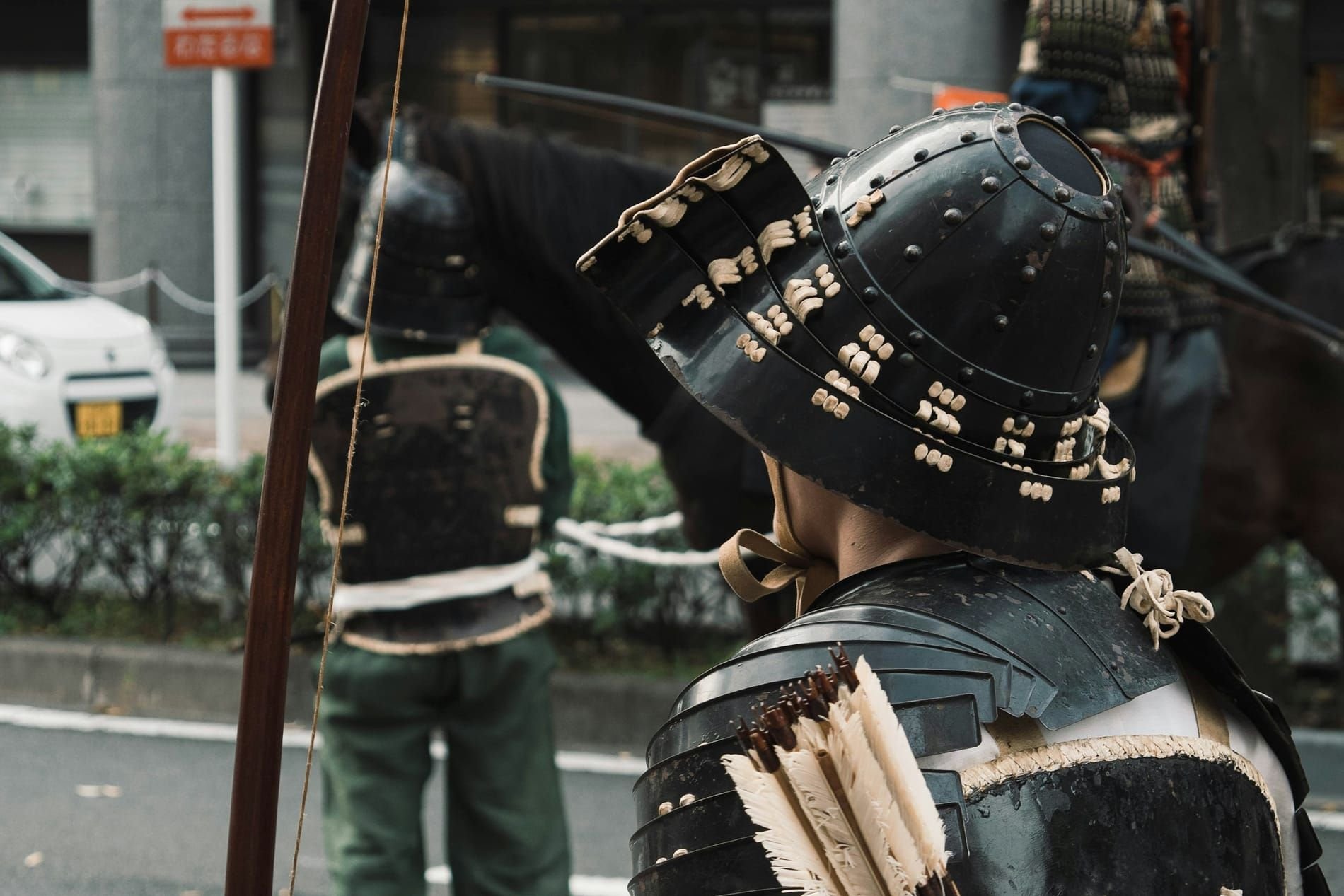 A samurai in armour with a bow and a quiver of arrows